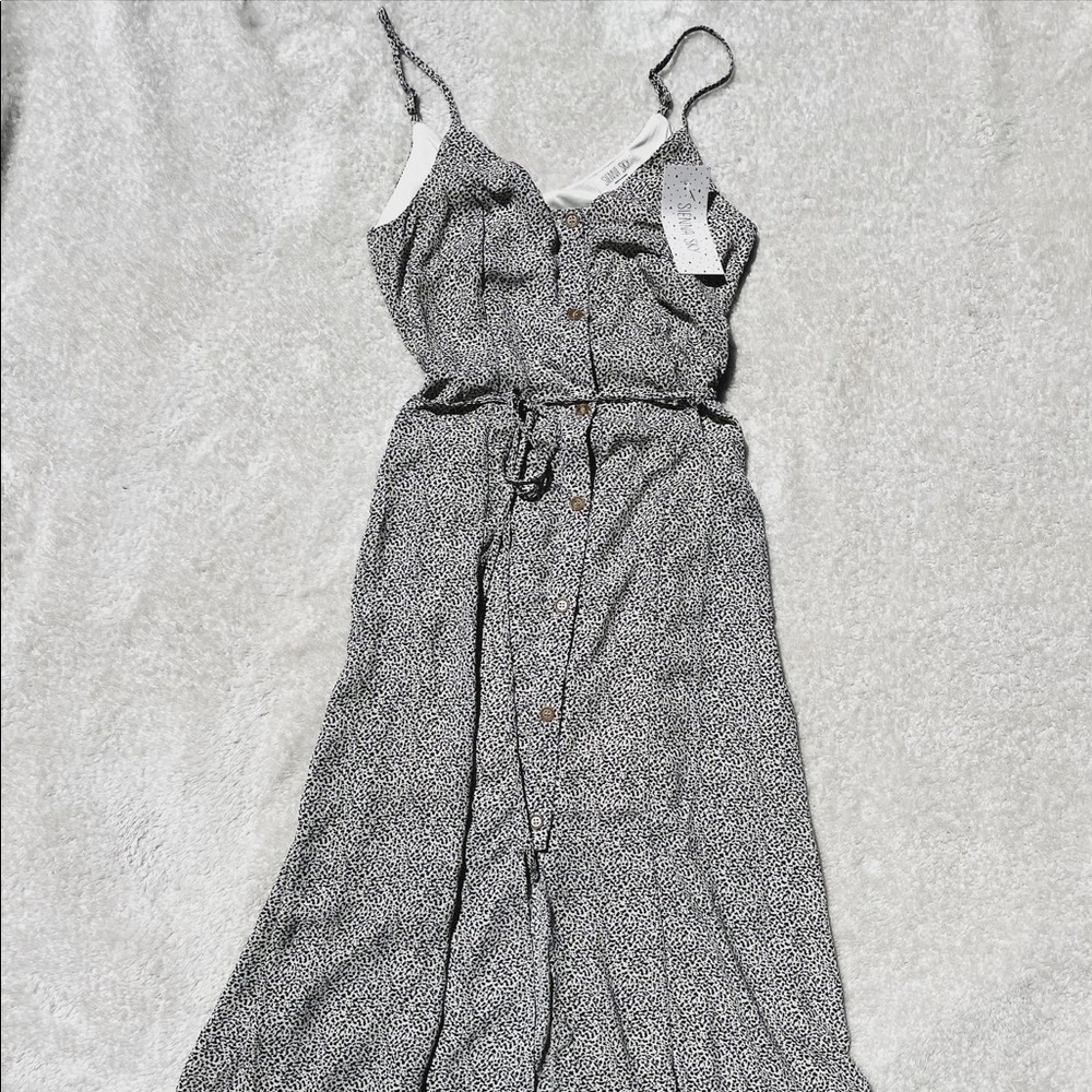 SIENNA SKY size xs fully functional button down dress.